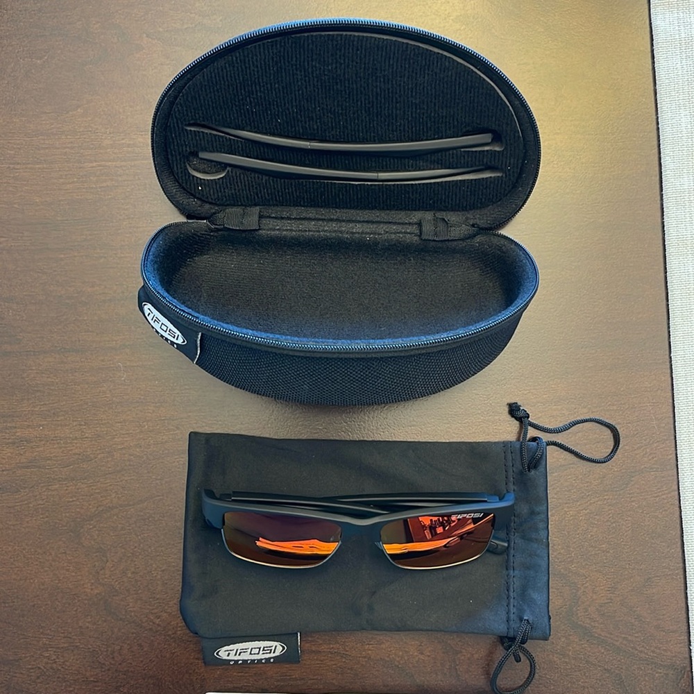Sunglasses never used, with hard case, cover and extra set of ear pieces.